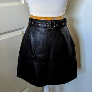 DIVIDED BLACK FAUX LEATHER  SKIRT SIZE 4 BELTED NWOT.